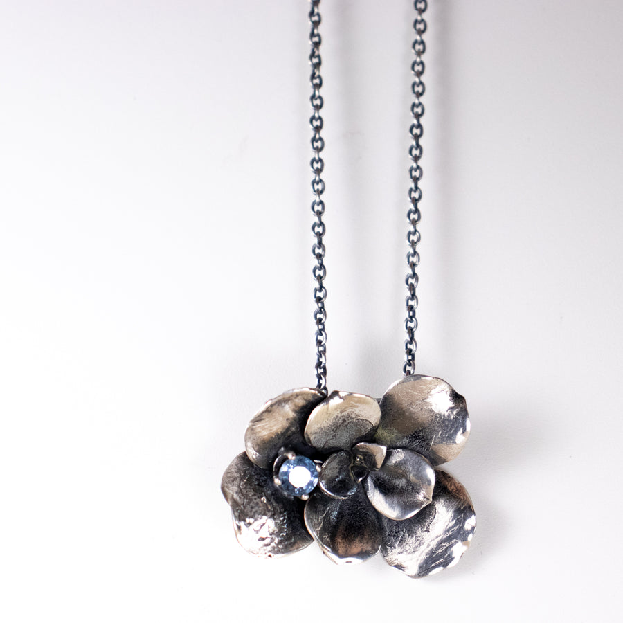 sterling silver large floral succulent necklace with 5.5 mm prong set light blue sapphire