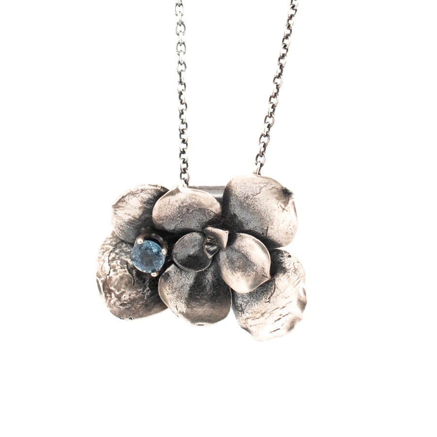 sterling silver large floral succulent necklace with 5.5 mm prong set light blue sapphire